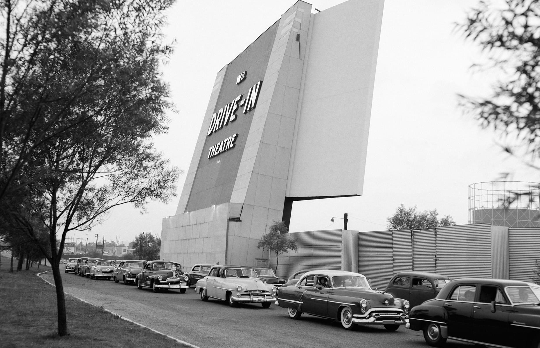 Teens queuing for a drive-in theatre, 1950s